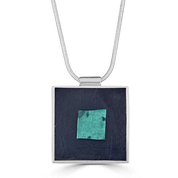 Glass Pool Necklaces Ronnie Taubenfeld transparent teal Murano glass square embedded in black resin and set in sterling silver square hangs from silver snake chain. handmade