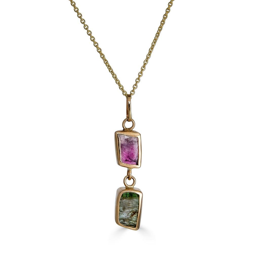 Jeweled Lavalier Necklace Ronnie Taubenfeld a green rectangular Tourmaline gem hanging from a pink rectangular Tourmaline. Both are handset in 14K gold suspended from a 14k gold cable chain.