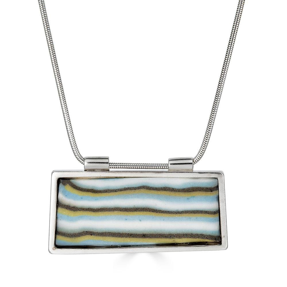 Shalva Pendant by Ronnie Taubenfeld is a handmade striped porcelain tile set in a sterling silver frame, with a silver snake chain.
