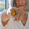Large rectangular sterling silver ring with 24K gold-fused glass set in black resin.