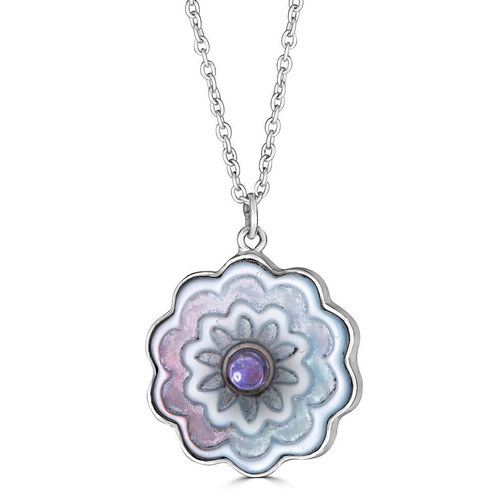 Colorful Zinnia Necklace Ronnie Taubenfeld is handmade using carved mother of pearl with Iolite cabochons set  front and back and framed in sterling silver