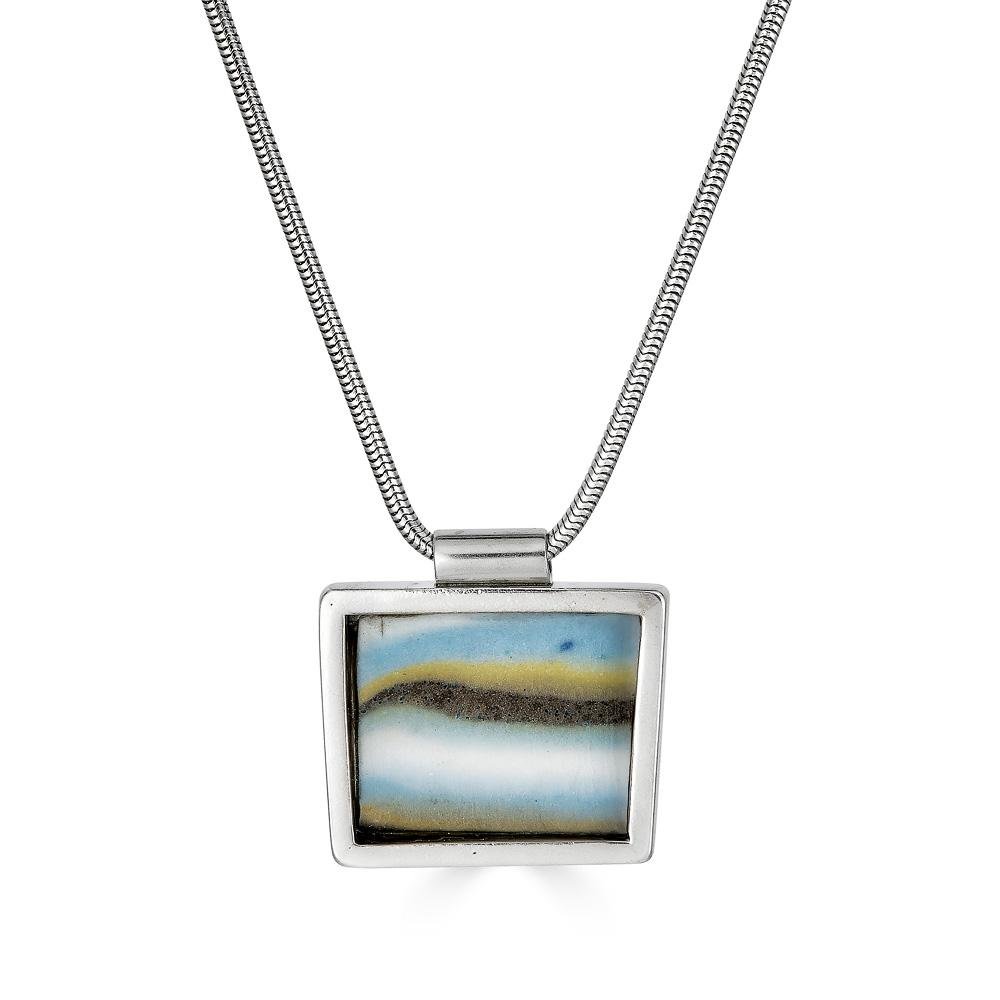 Gal Pendant by Ronnie Taubenfeld is a handmade porcelain tile set in sterling silver frame hanging from a silver snake chain