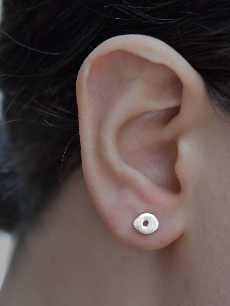 Gaua Studs Earrings Ronnie Taubenfeld shown on a woman's ear for size