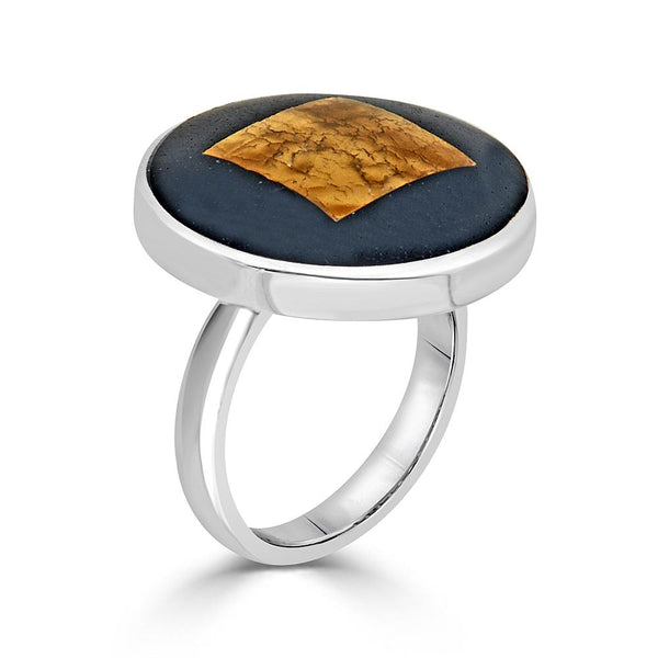 Gold Domed Ring by Ronnie Taubenfeld is a handmade sterling silver round setting framing a 24k yellow gold-fused Murano glass square embedded in black resin.