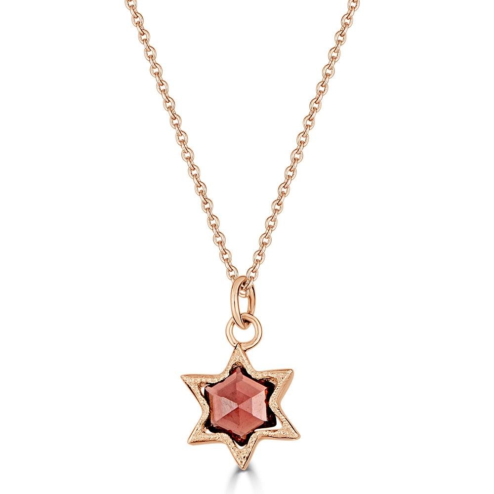 Gossamer Star Necklace Ronnie Taubenfeld is a delicate 14K yellow gold star-shaped setting with open back and milgrain details, with a star-cut red Tourmaline gem inside, hanging from a 14k gold cable chain. Handmade.