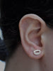 Hibu Studs Earrings Ronnie Taubenfeld shown on a woman's ear.