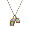 Paired Tourmalines Necklace by Ronnie Taubenfeld is handmade using two Watermelon Tourmaline gems set in 14K gold, suspended from a gold cable chain.