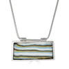 Shalva Pendant by Ronnie Taubenfeld is a handmade striped porcelain tile set in a sterling silver frame, with a silver snake chain.