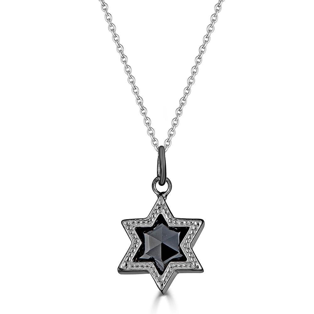 Silver Ethereal Star Necklace by Ronnie is a silver 6 pointed star set with a star cut black Spinel gem and hanging from a silver cable chain.