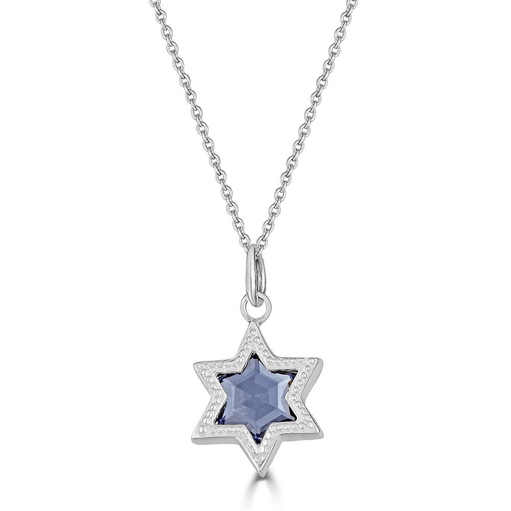 Silver Ethereal Star Necklace by Ronnie is a silver 6 pointed star set with a star cut blue Iolite gem and hanging from a silver cable chain.
