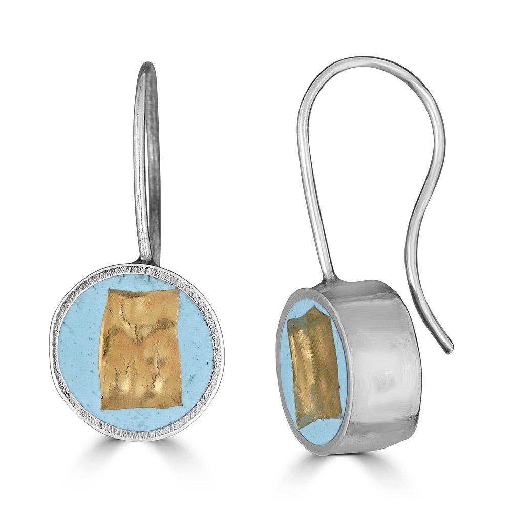 Square in a Circle DropDrop Earrings by Ronnie Taubenfeld are sterling silver self-locking disks with a 24K yellow gold-fused glass smalto embedded in pale blue resin and set within.