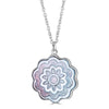 Zinnia Necklace by Ronnie Taubenfeld is a carved mother of pearl flower channel set in sterling silver, hanging from a silver cable chain.